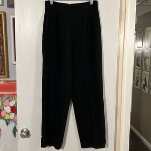 Laura Madrigano black 100% wool gabardine. Back hidden zip closure   Fully lined